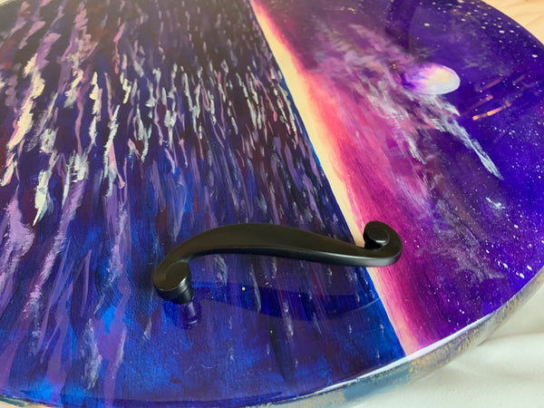 Moon and ocean night scene round serving or charcuterie tray