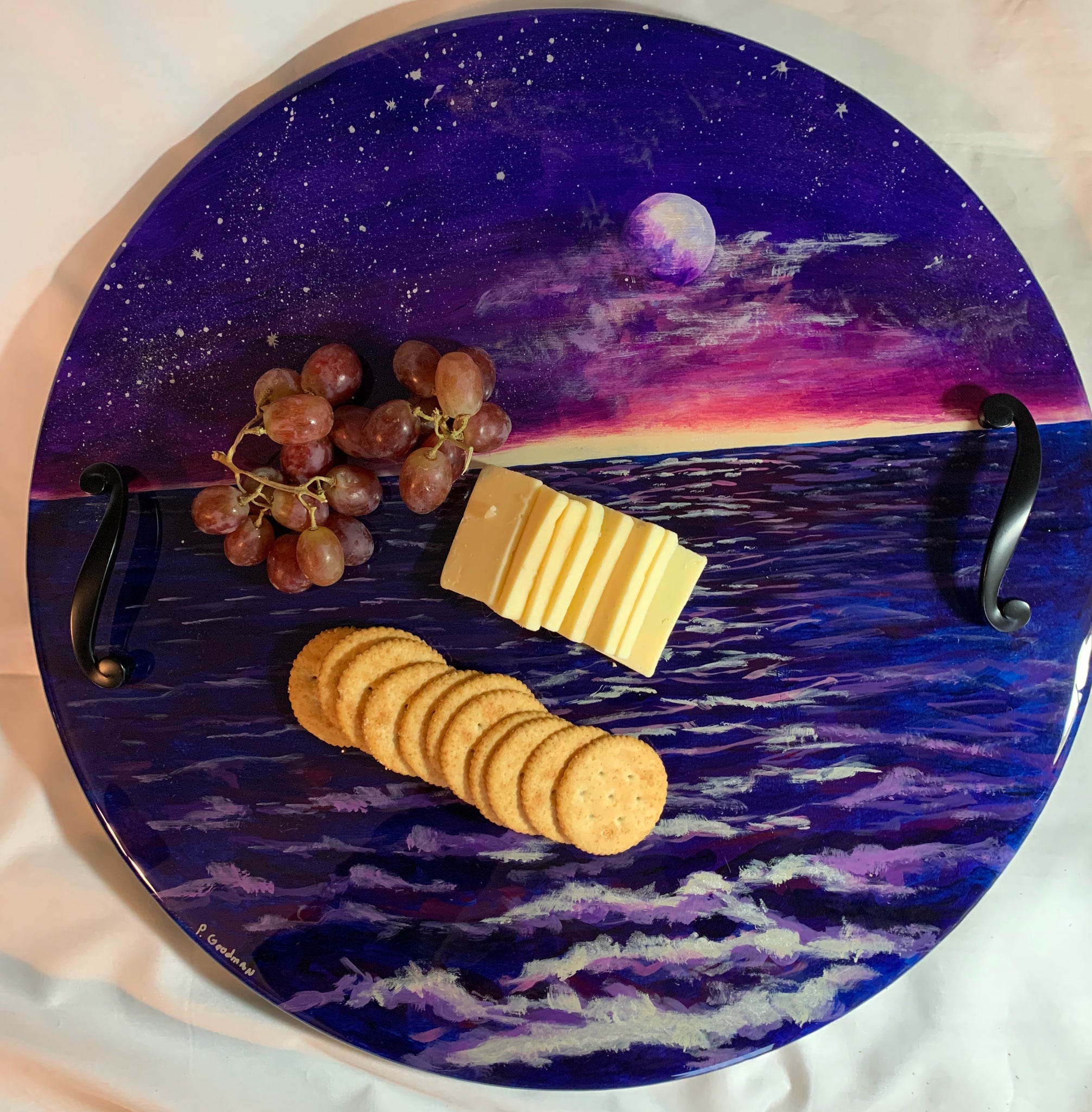 Moon and ocean night scene round serving or charcuterie tray