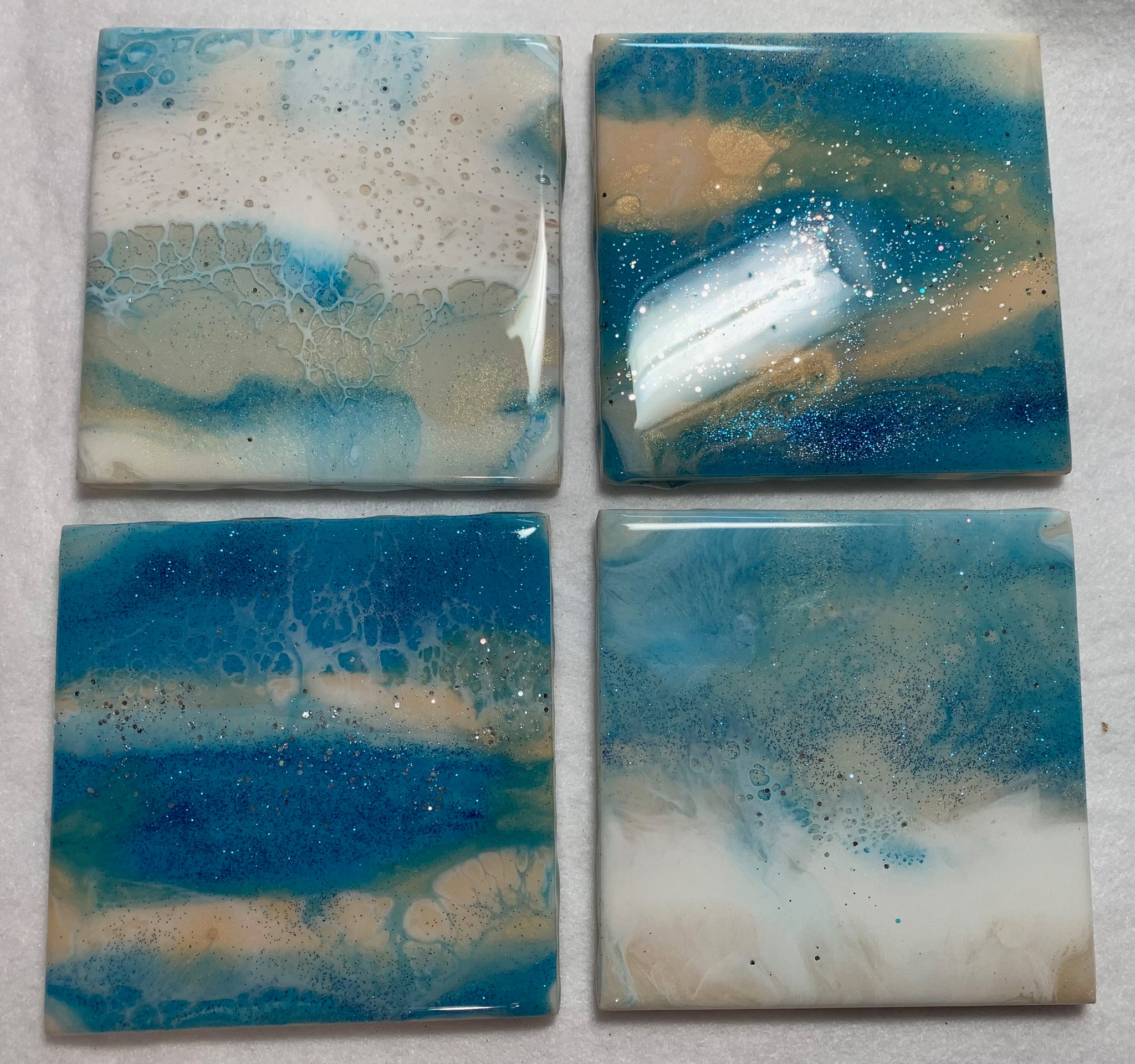 Ocean wave blue, sand and white, sparkly resin, ceramic coasters
